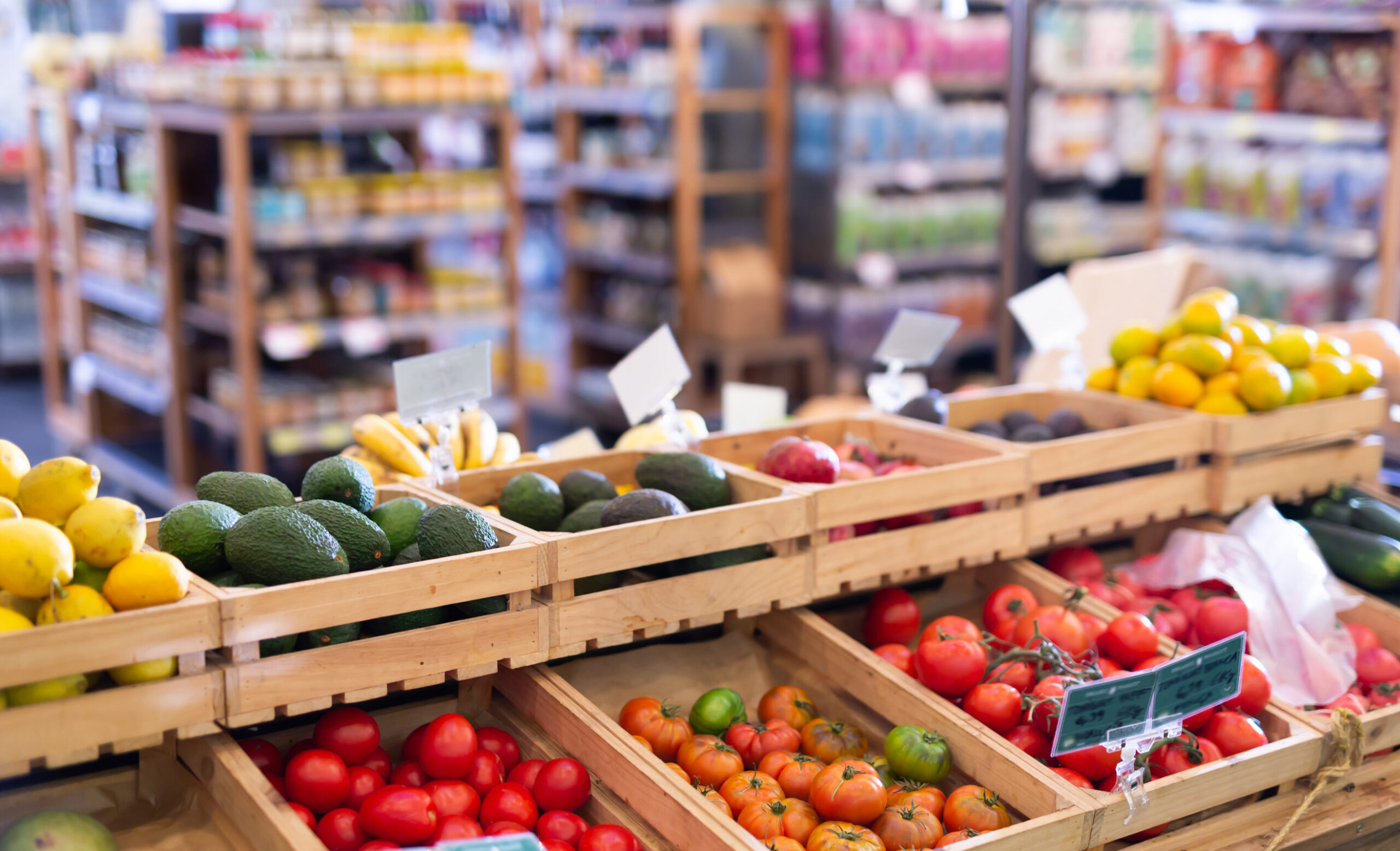 Showcase with fresh vegetables and fruits in supermarket